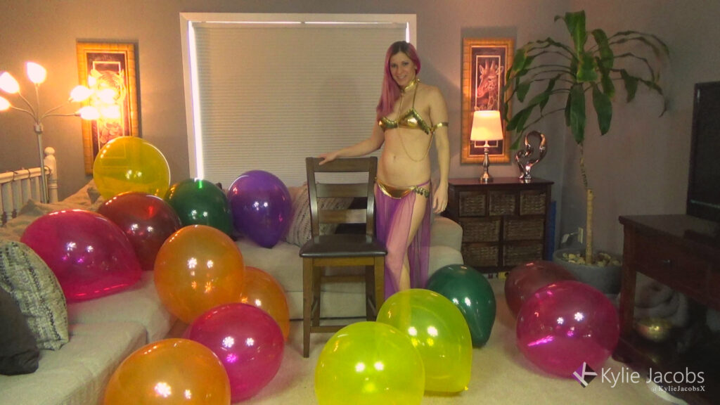 Sexy genie pops a living room full of big 17" crystal balloons.